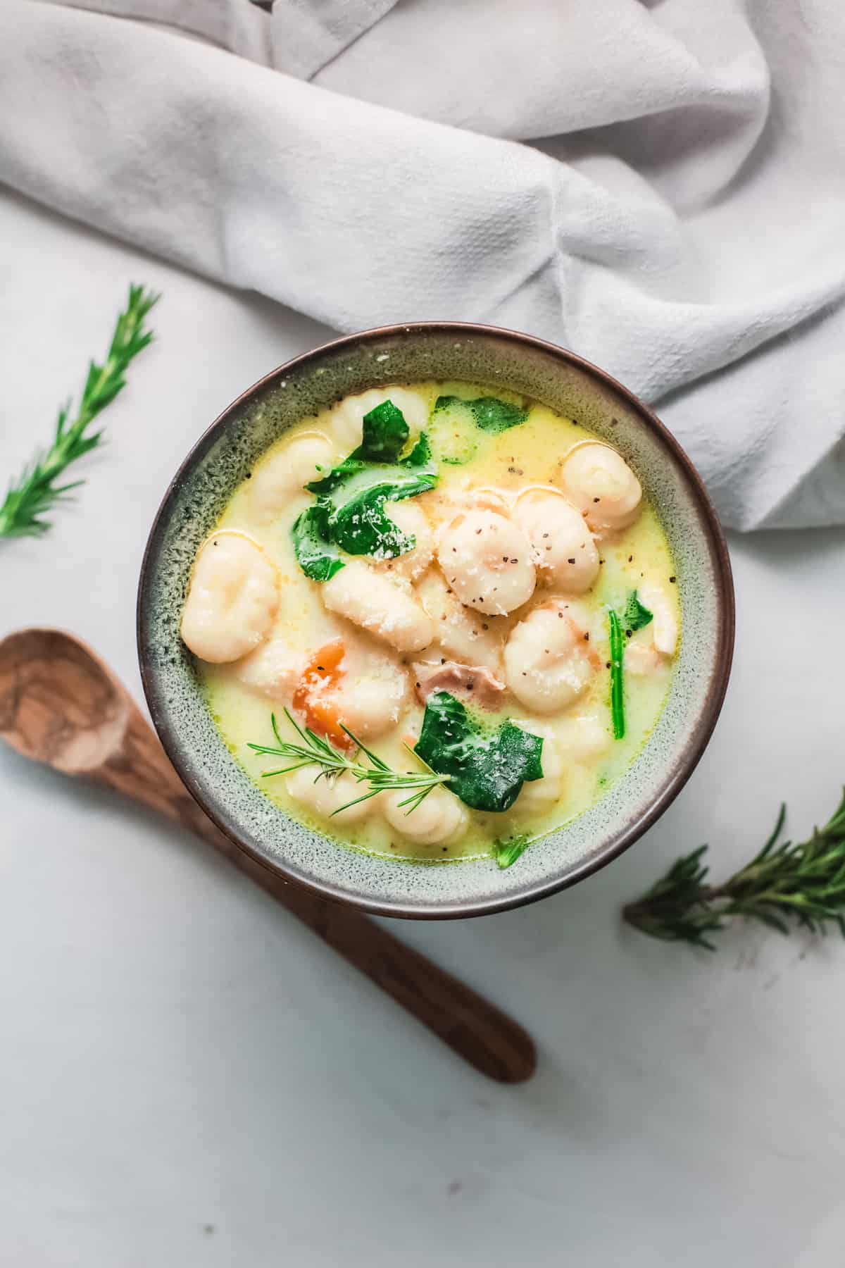 a bowl filled with instant pot chicken gnocchi soup
