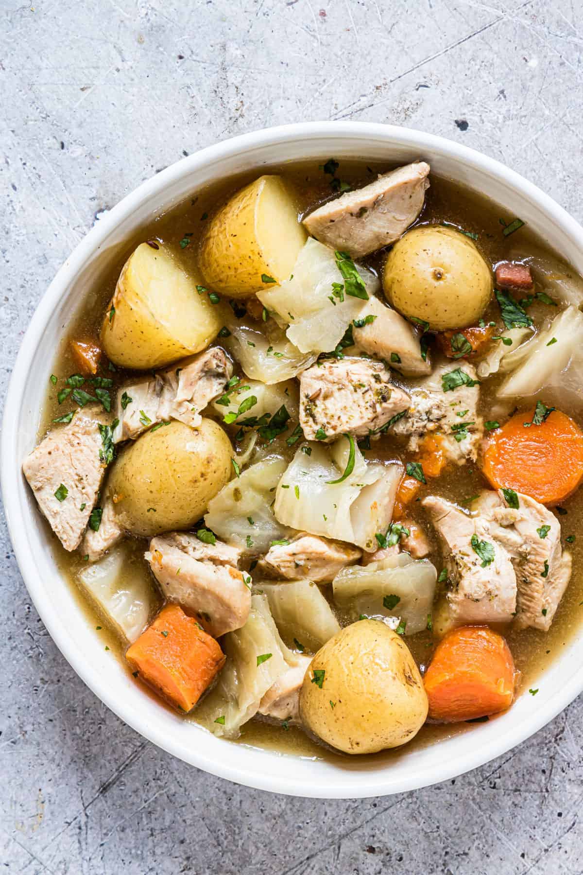 a serving of instant pot chicken stew in a ceramic bowl