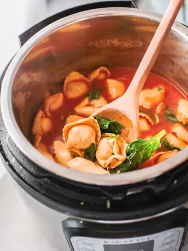 top down view of the finished instant pot chicken tortellini soup inside the instant pot