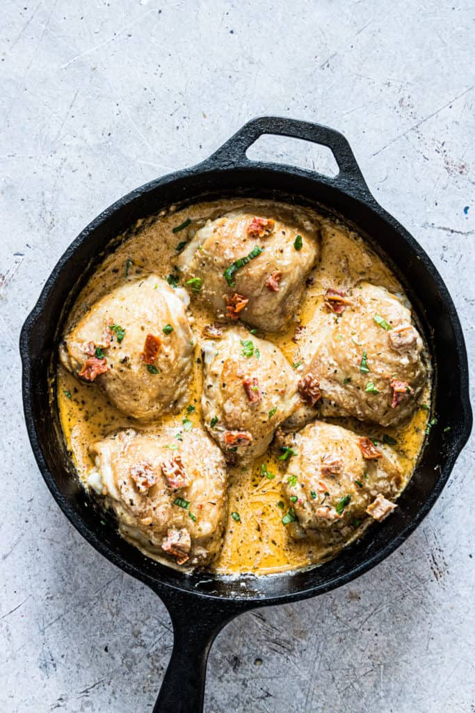 a cast iron skillet containing the completed Sicilian chicken recipe