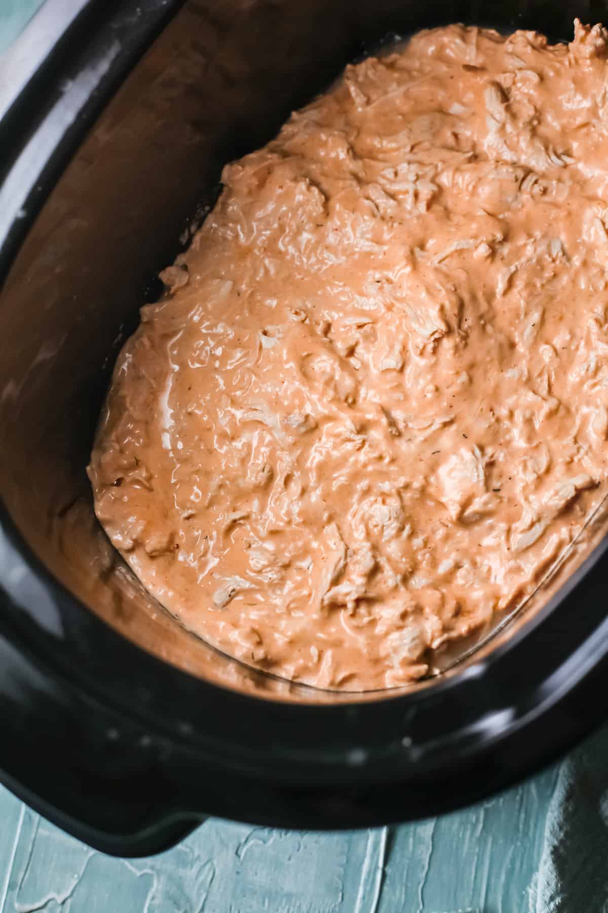 the completed buffalo chicken dip inside the crockpot