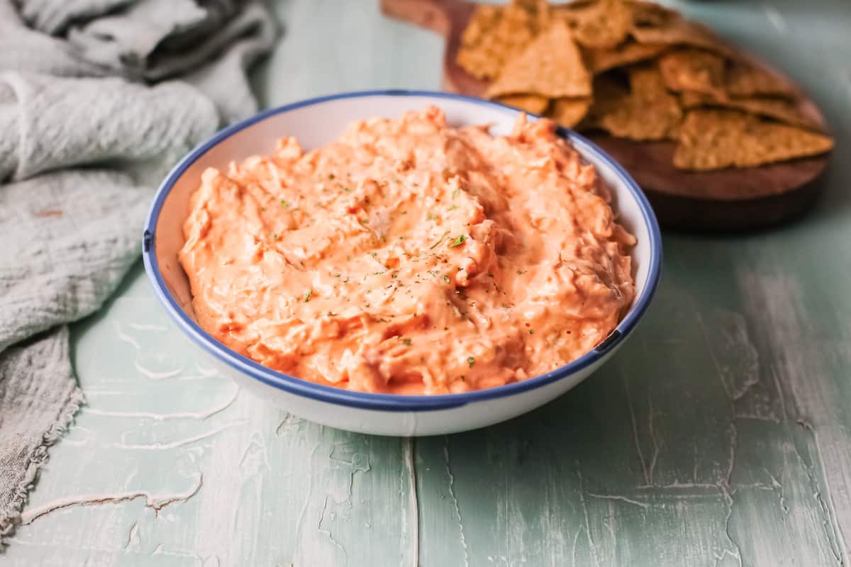 a bowl filled with the completed slow cooker buffalo chicken dip