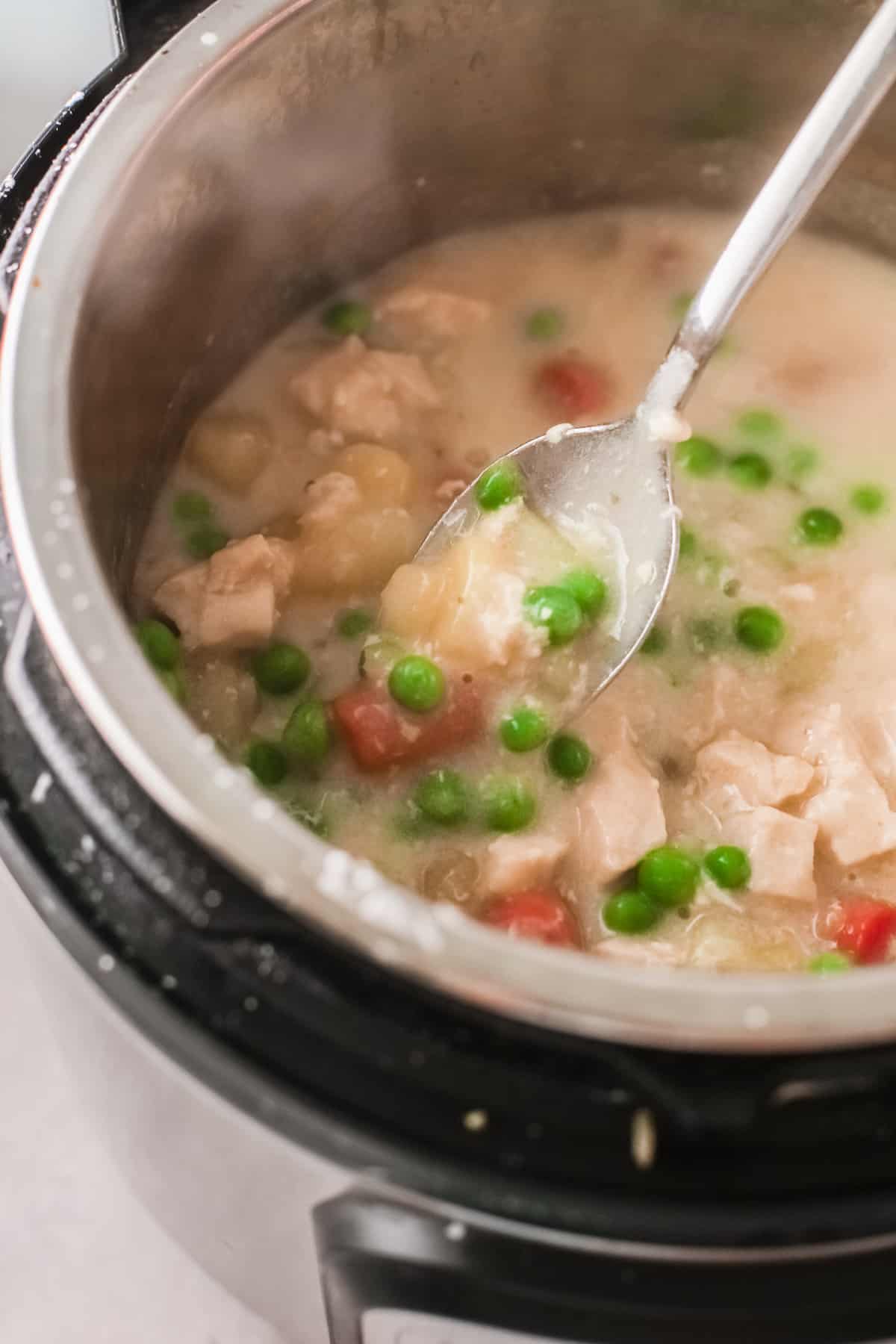 close up view of the cooked chicken pot pie soup inside the instant pot