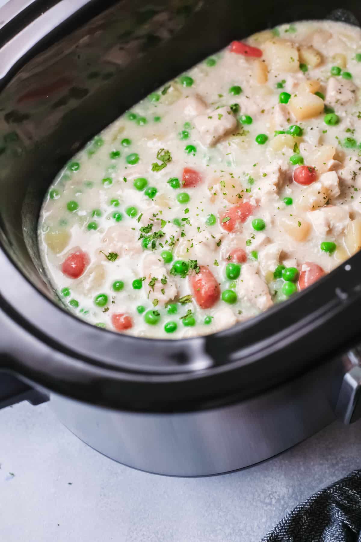 top down view of the completed chicken pot pie inside the slow cooker