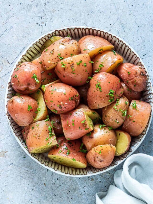 top down view of a ceramic bowl filled with Instant Pot Red Potatoes