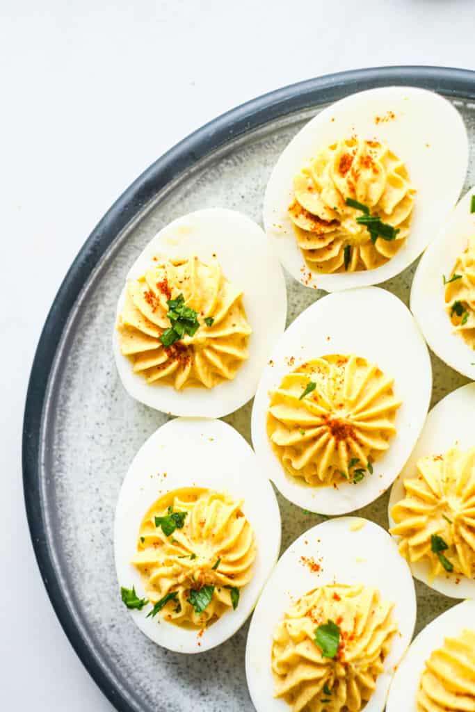 the finished deviled eggs on a countertop and ready to serve