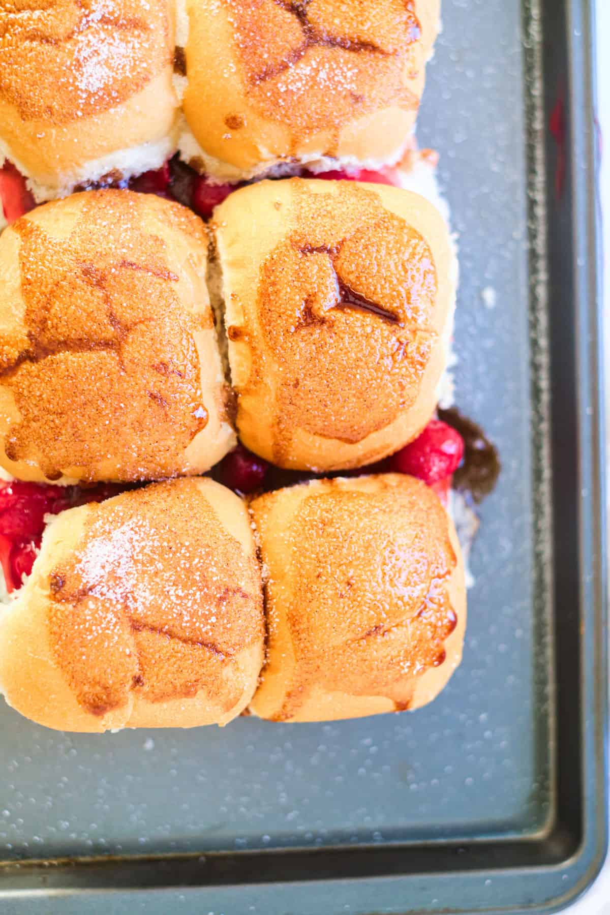 top down view of a pan filled with cherry pie sliders