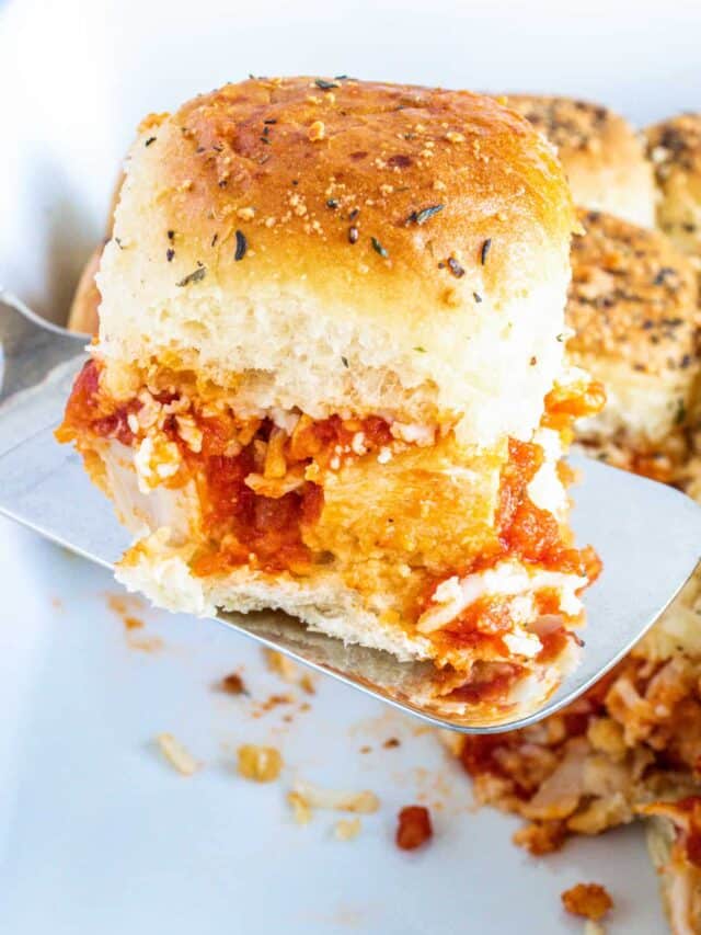 close up view of one of the completed chicken parmesan sliders being served