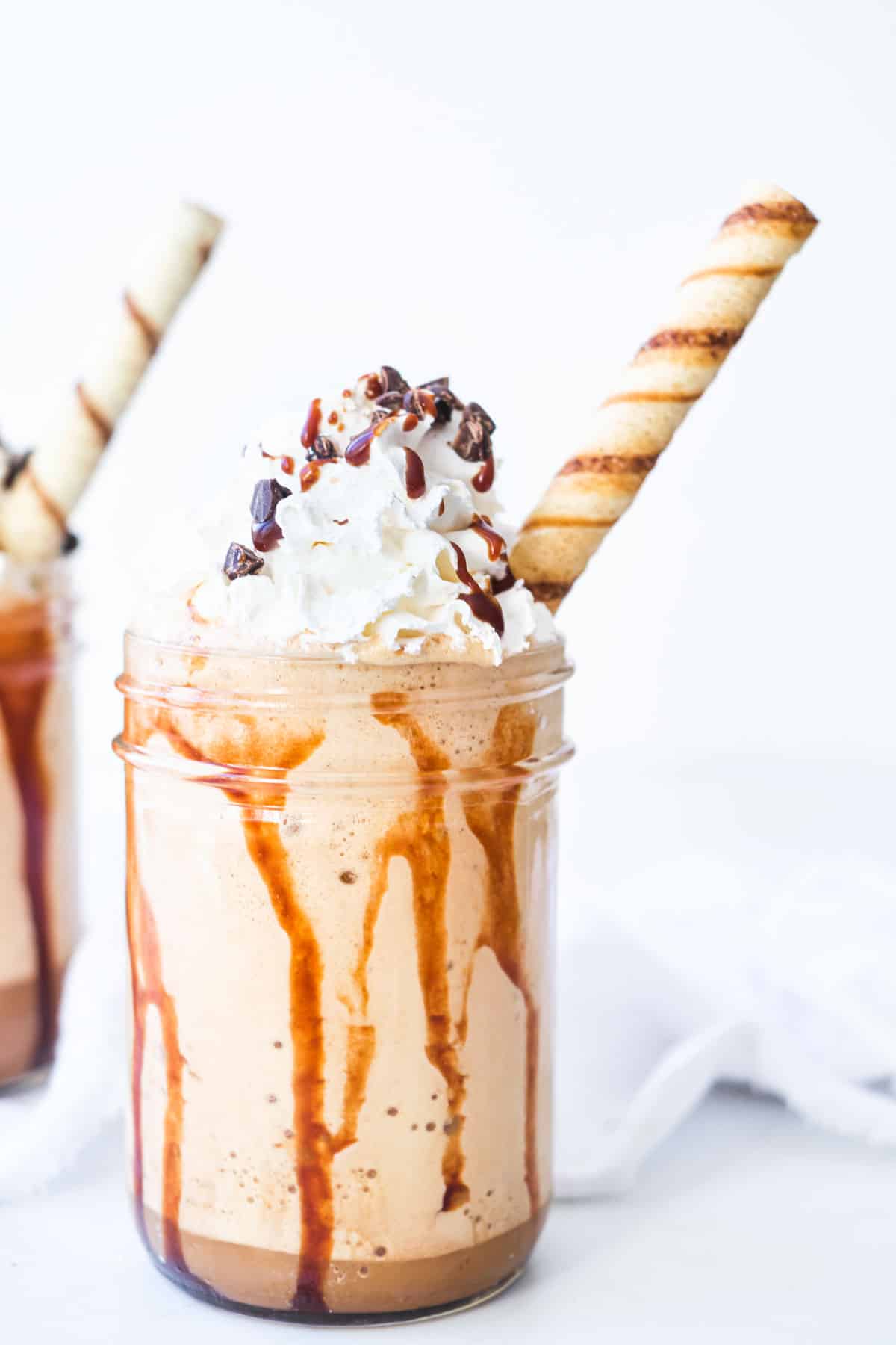 close up of a mocha frappe with a wafer