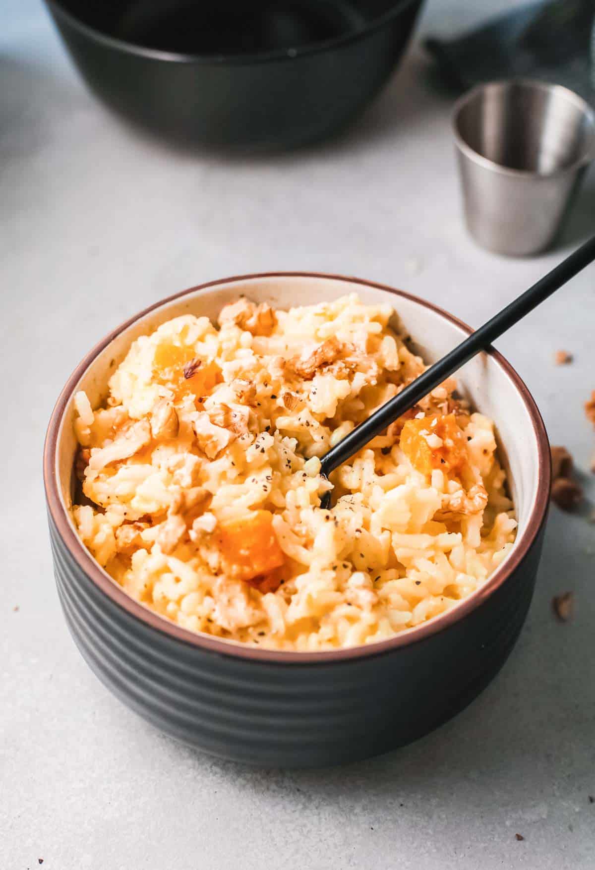 a bowl filled with the completes instant pot risotto recipe