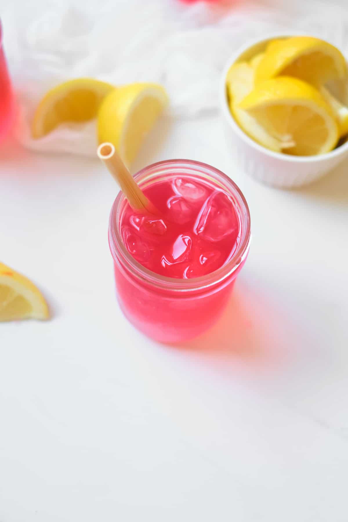 top down view of the finished Starbucks Passion Tea Lemonade in a mason jar and served with a straw
