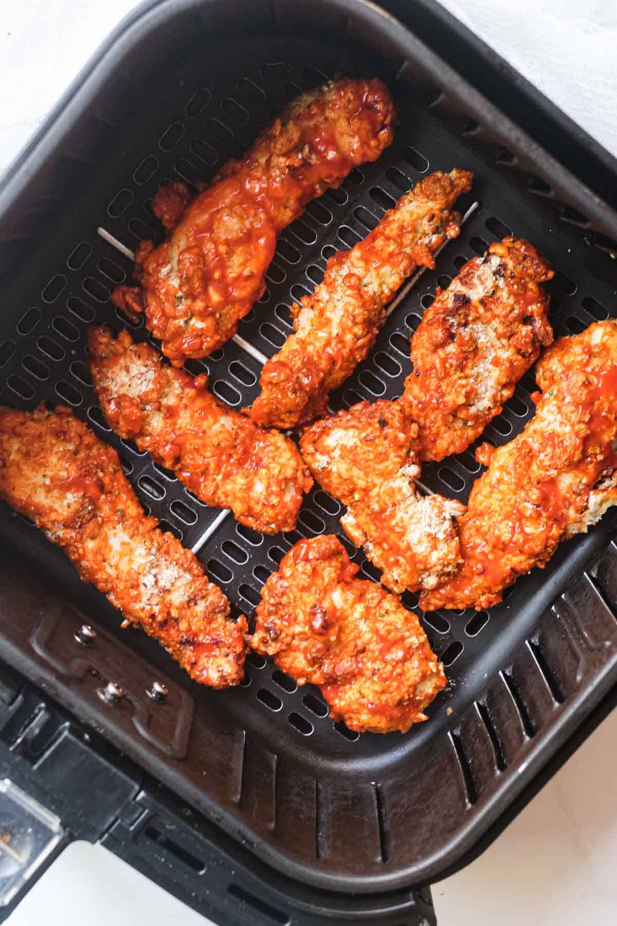 top down view of the buffalo chicken tenders in air fryer basket