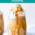 caramel frappe in a glass topped with whipped cream
