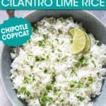 a bowl of cilantro rice garnished with lime