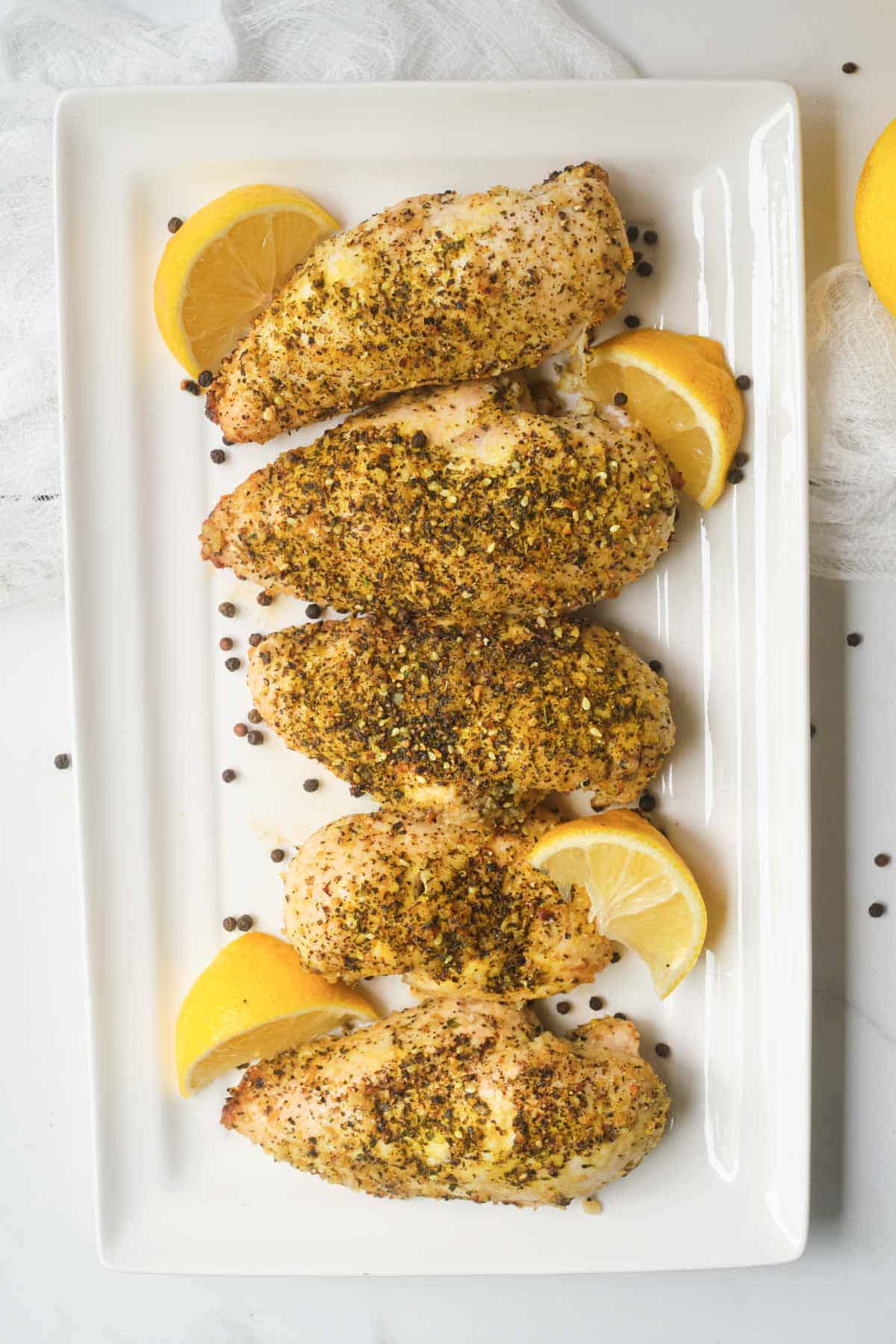 top down view of the competed lemon pepper chicken served on a white dish
