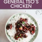 general tso's chicken in a bowl over white rice