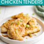 a plate of chicken tenders garnished with green onion