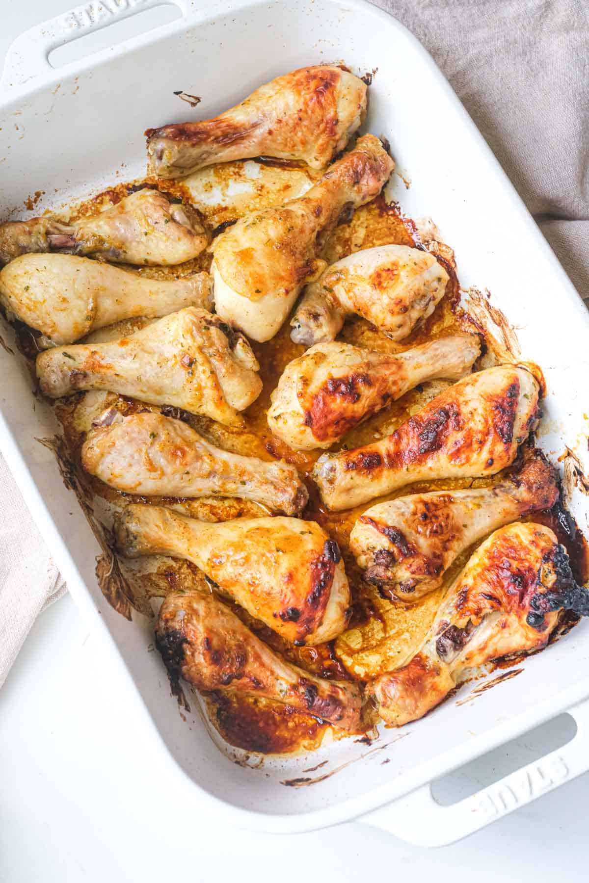 top down view of the completed ranch chicken drumsticks inside a baking dish