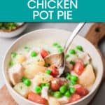 chicken pot pie in a bowl with a spoon