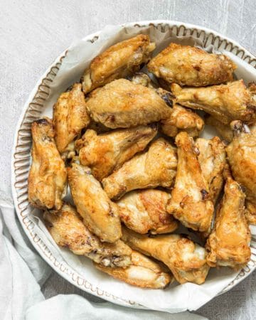 the completed frozen chicken wings in air fryer recipes served on a plate
