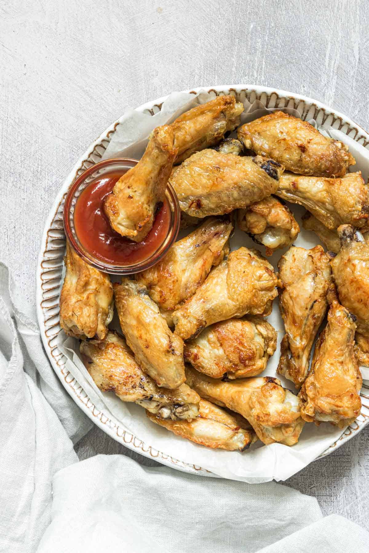 the finished air fryer frozen chicken wings served with dipping sauce