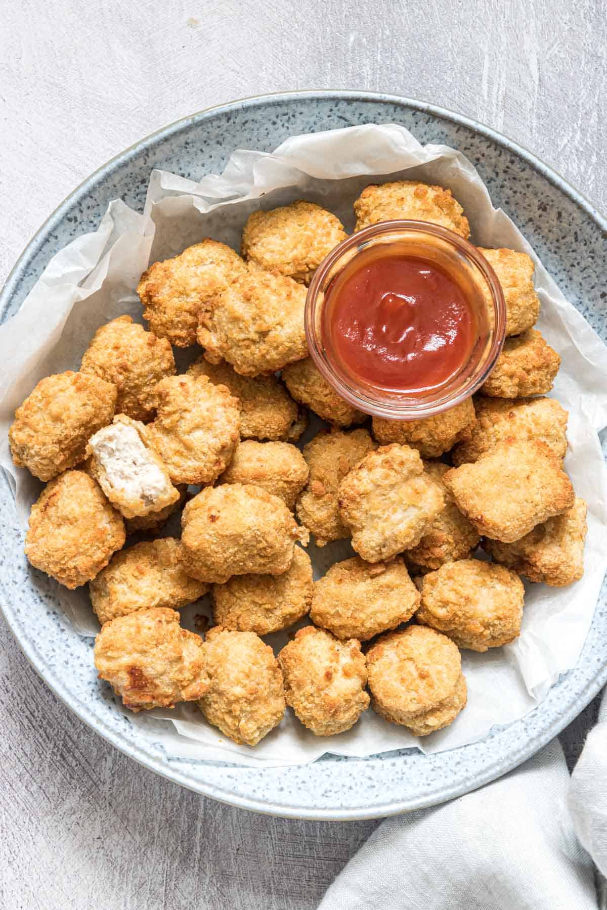 a plate filled with reheat chicken nuggets in air fryer