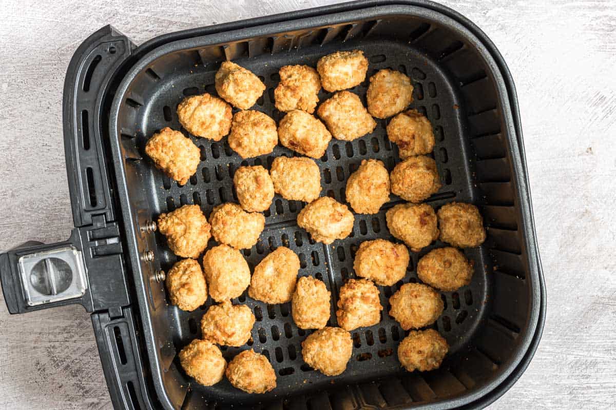 top down view of reheat chicken nuggets in air fryer basket