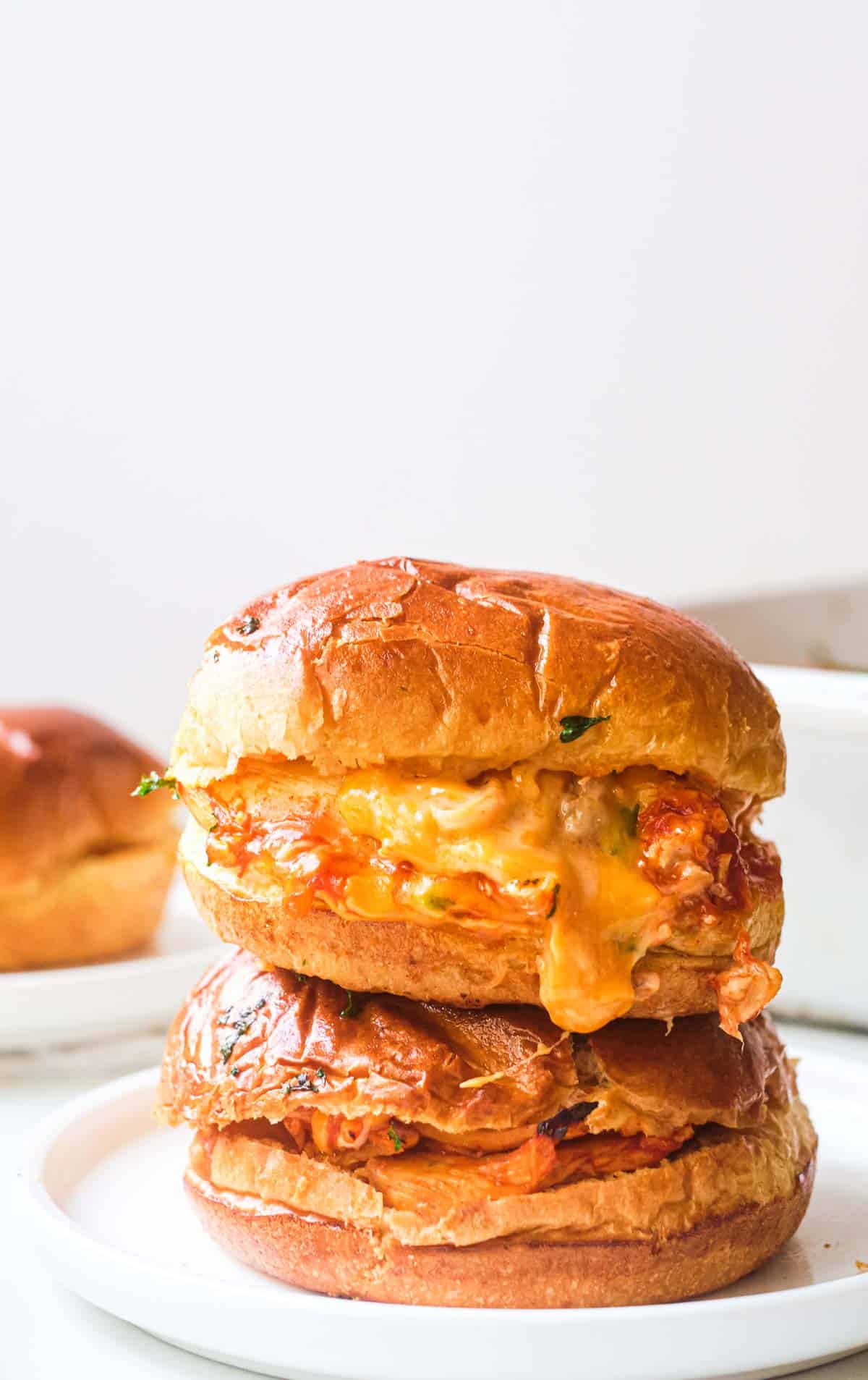 two buffalo chicken sliders stacked on top of each other