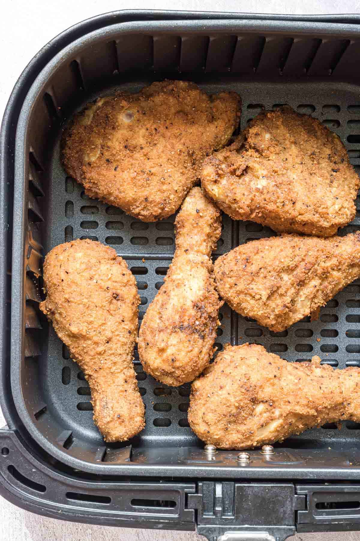 close up view of how to rehear fried chicken in air fryer