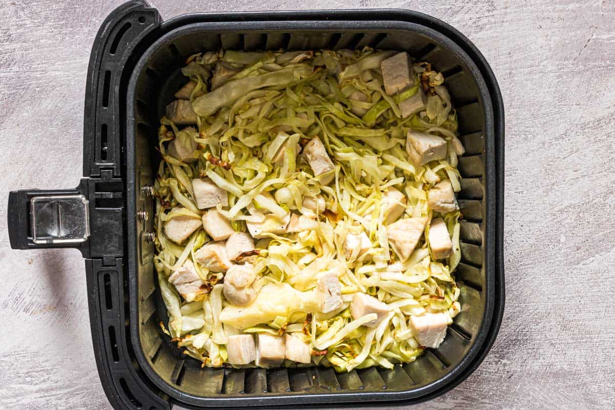 top down view of the air fryer chicken and cabbage