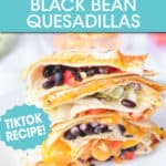 BLACK BEAN QUESADILLAS STACKED ON A PLATE