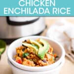 A bowl of chicken enchilada rice garnished with avocado in front of an instant pot