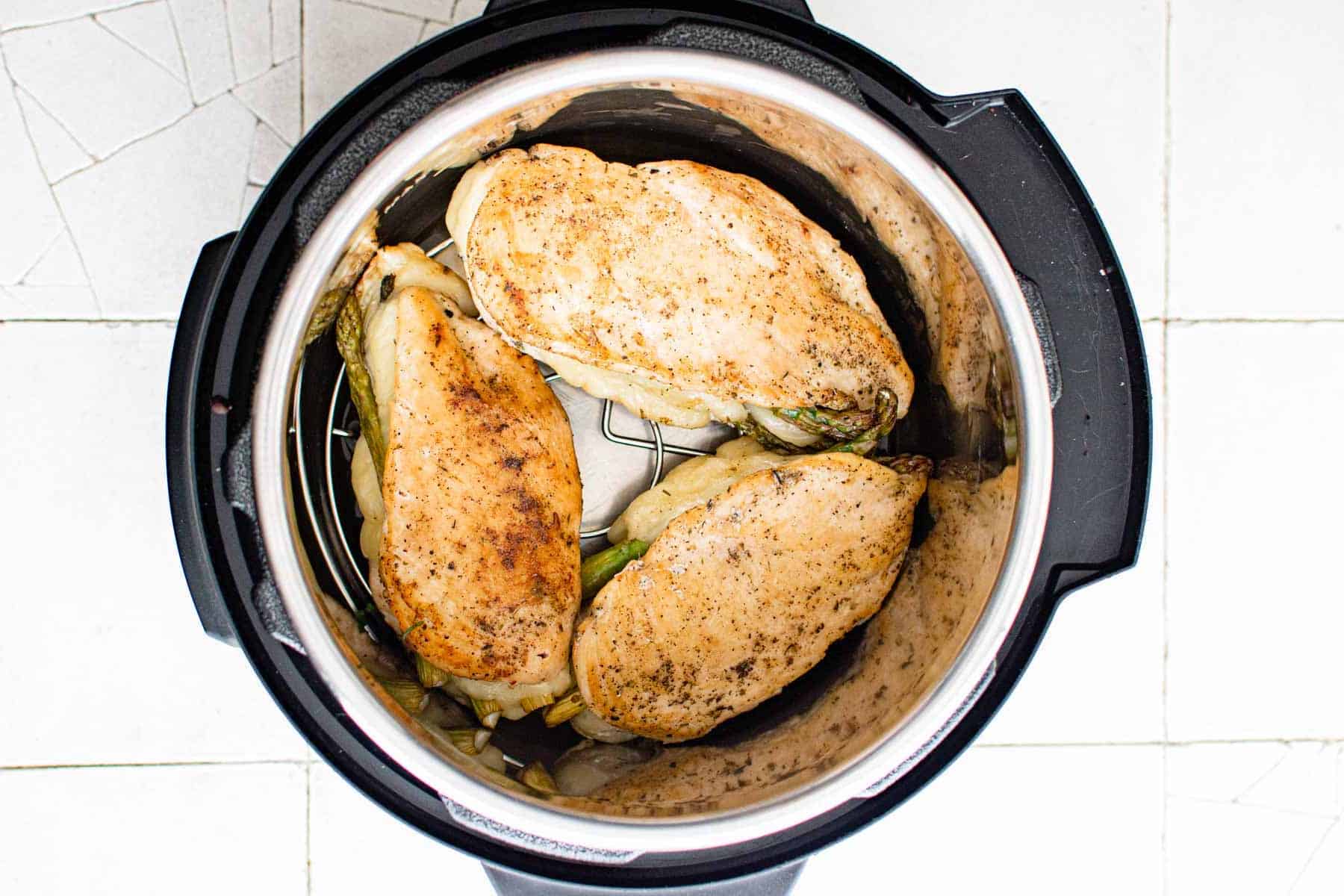 top down view of the stuffed chicken breast in instant pot