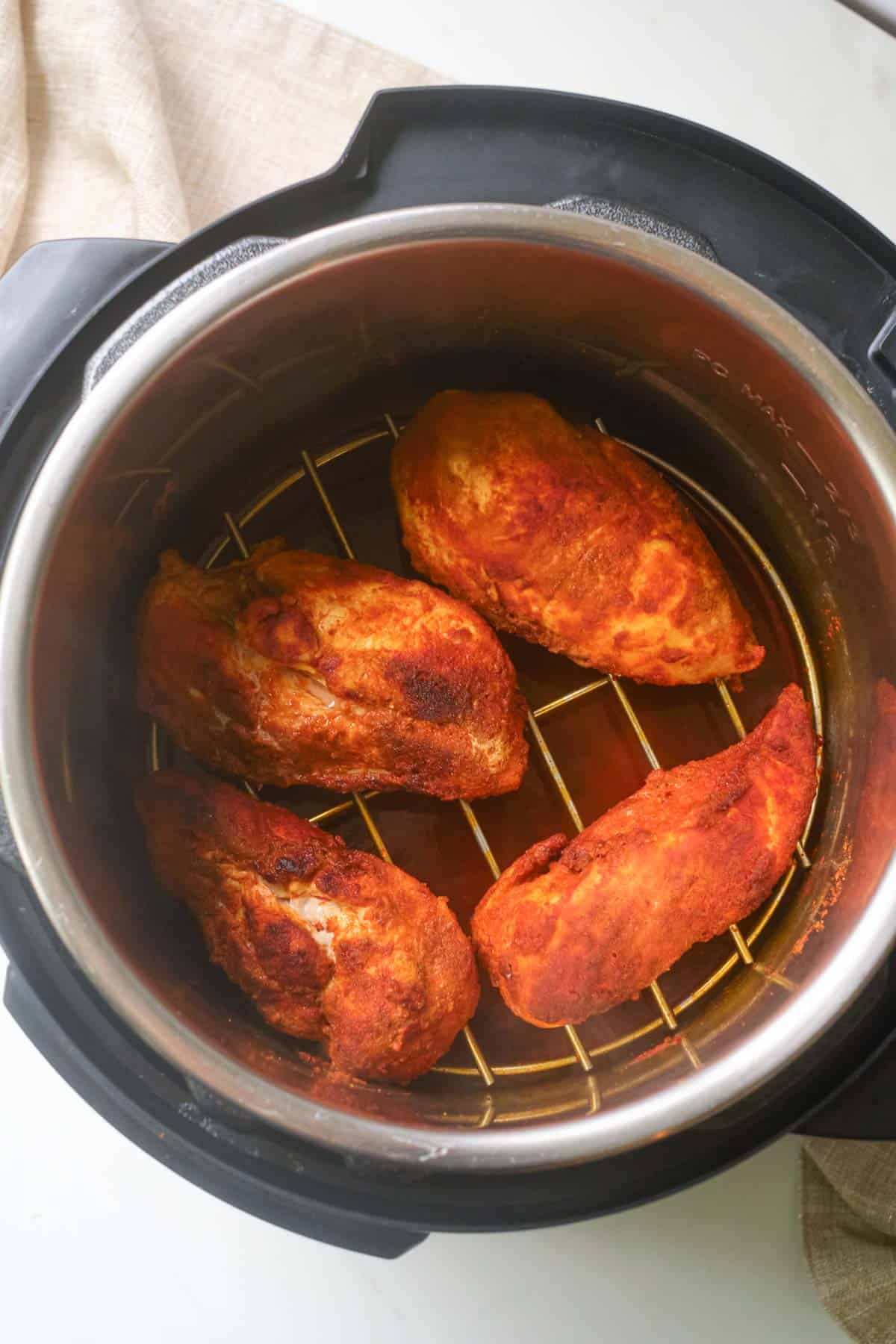 top down view of the finished instant pot chicken breast inside the instant pot