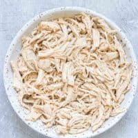 a bowl filled with instant pot shredded chicken