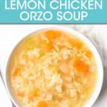 CHICKEN ORZO SOUP IN A BOWL WITH A SPOON NEXT TO IT
