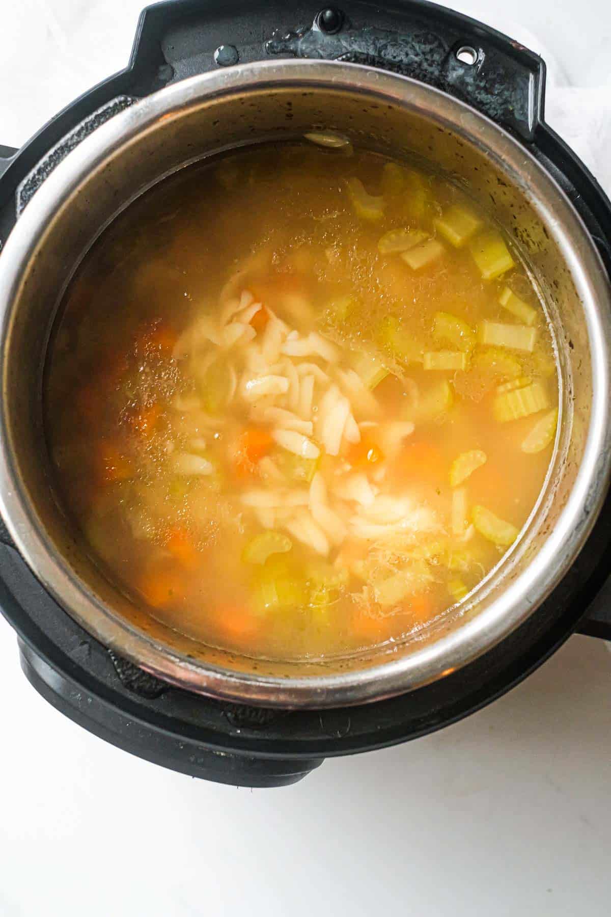 top down view of the finished instant pot lemon chicken orzo soup recipe