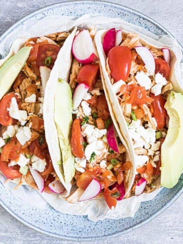 top down view of three instant pot shredded chicken tacos.