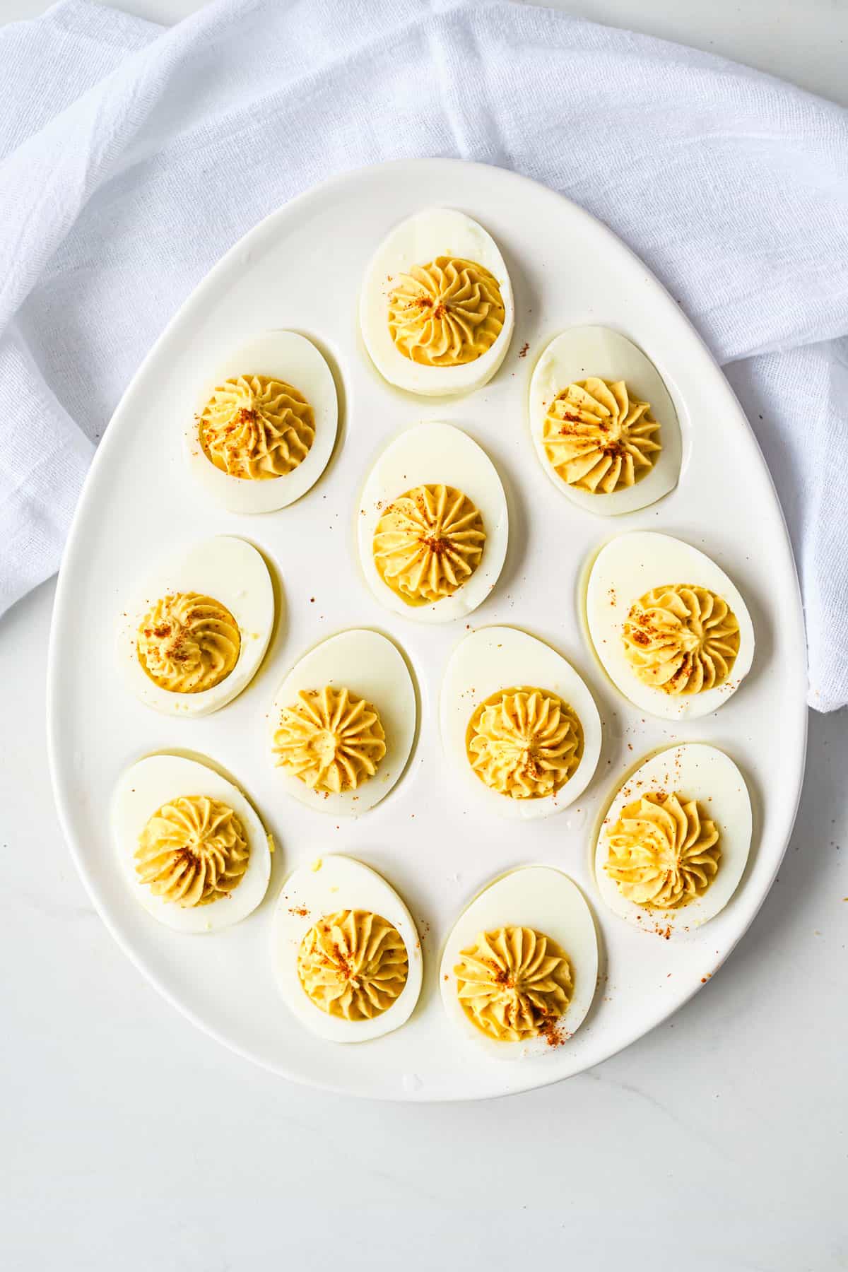 a plate of mexican deviled eggs on a ttable