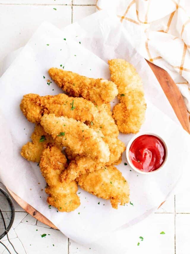 top down view of air fryer chicken tenders served on a white plate