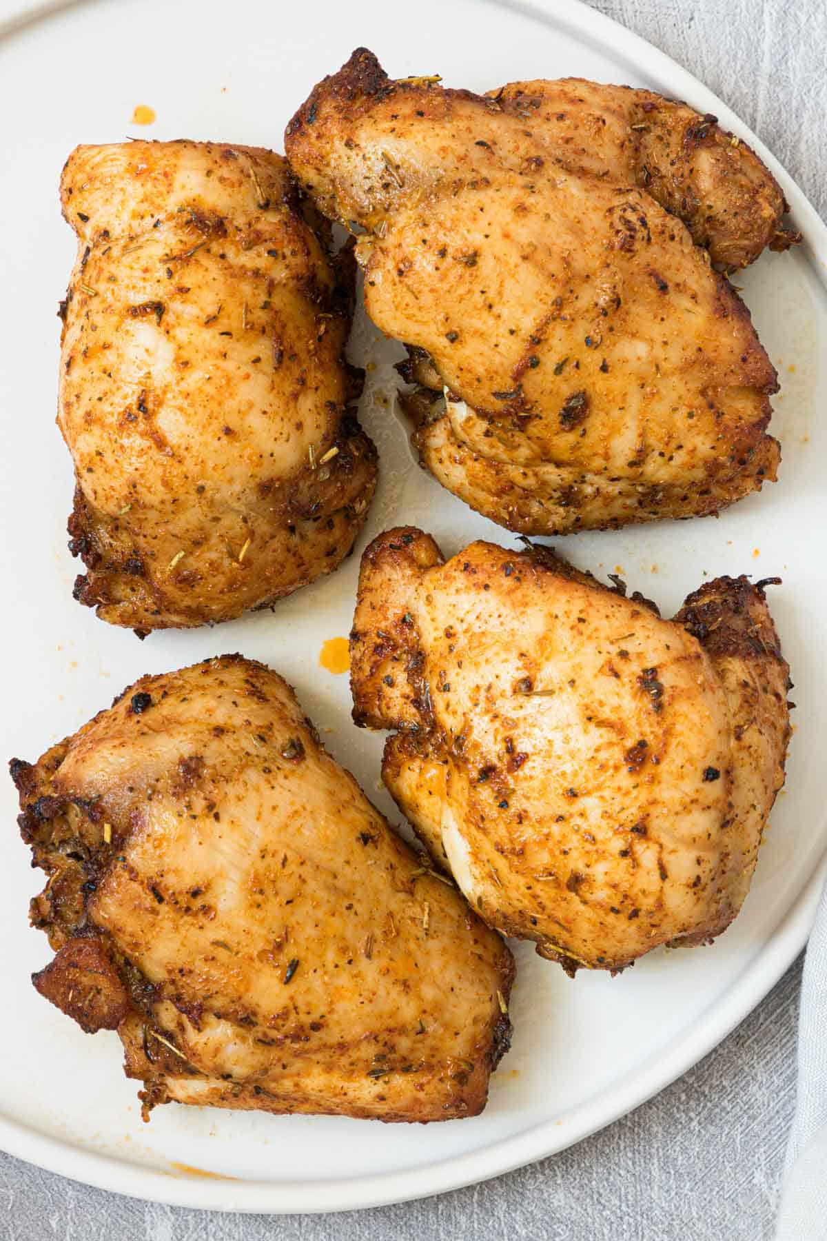 four chicken thighs that have been reheated in the air fryer