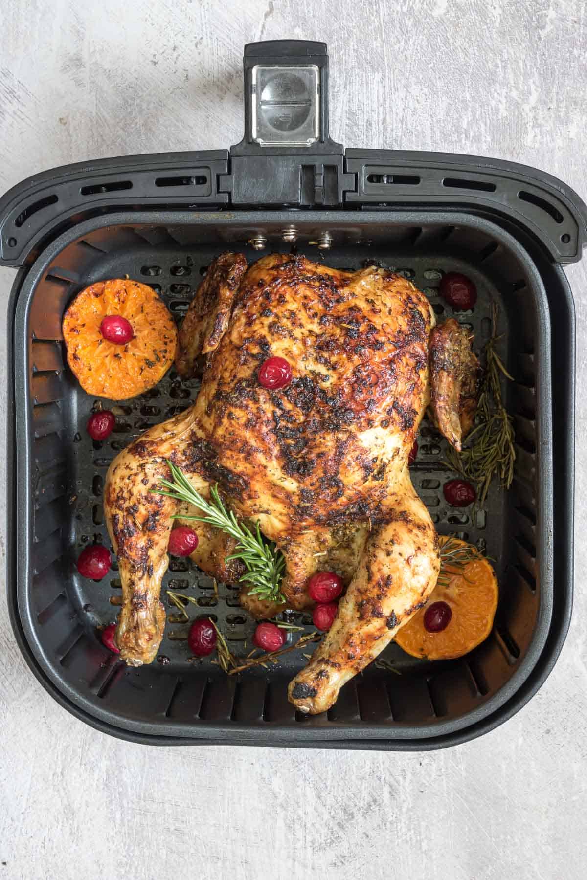top down view of the completed christmas chicken inside the air fryer basket