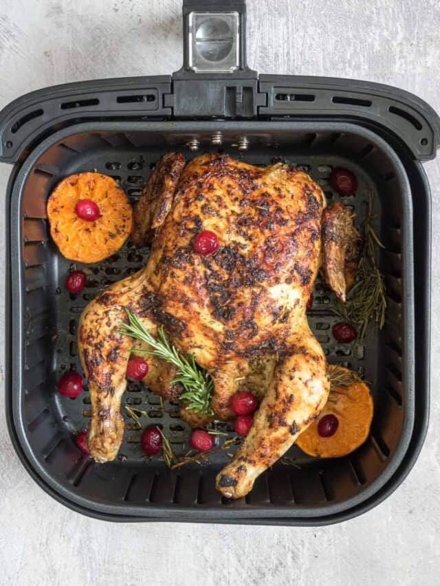 top down view of the completed christmas chicken inside the air fryer basket
