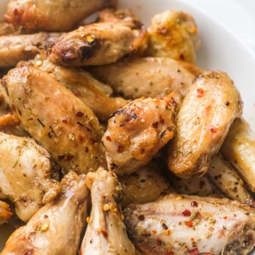 cajun chicken wings served in a white bowl