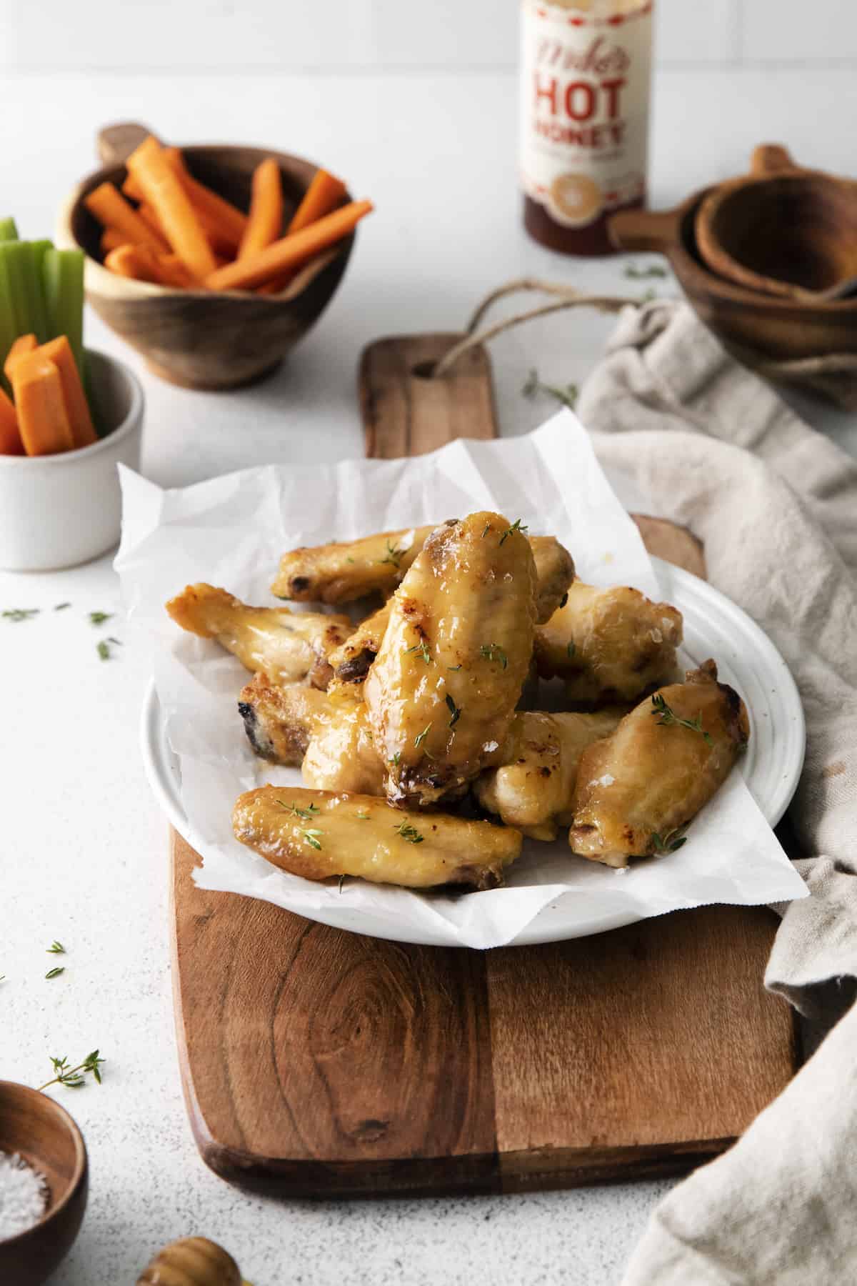 the completed honey hot wings recipe served on a white plate