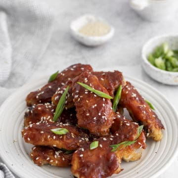 Korean chicken wings served on a white plate