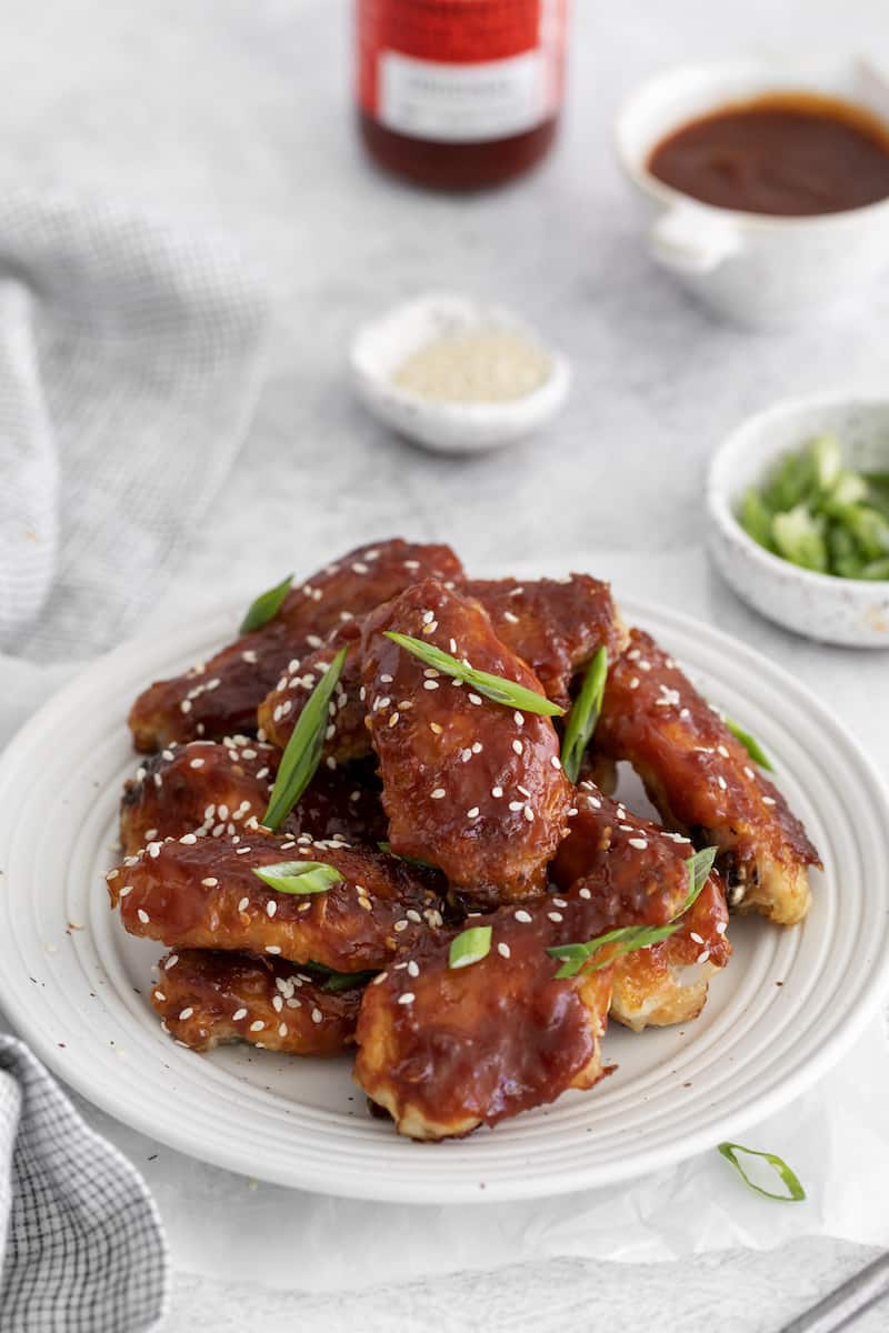 Korean chicken wings served on a white plate