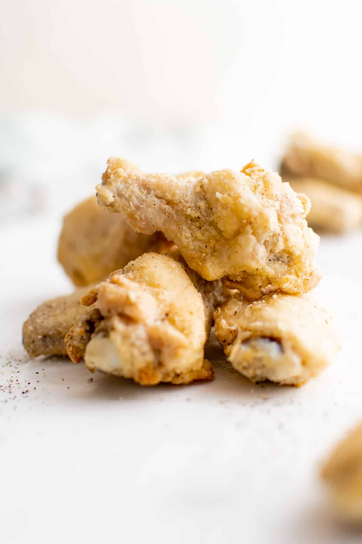 a portion of cooked chicken wings on a counter