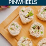 overhead view of chicken pinwheels on a cutting board.