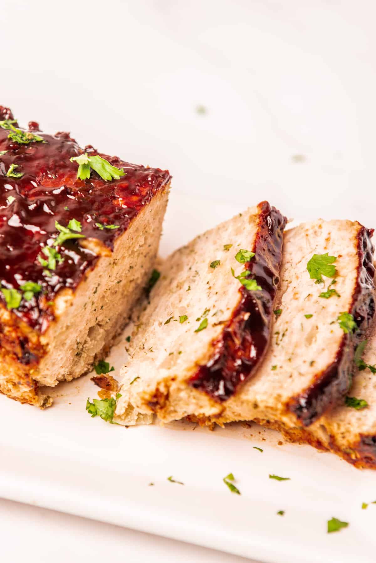 the sliced chicken meatloaf on a serving platter